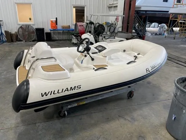 Blessed Yacht Photos Pics Inflatable Williams boat in a workshop, Azimut AZ 50-Fly, 2020 model nearby.