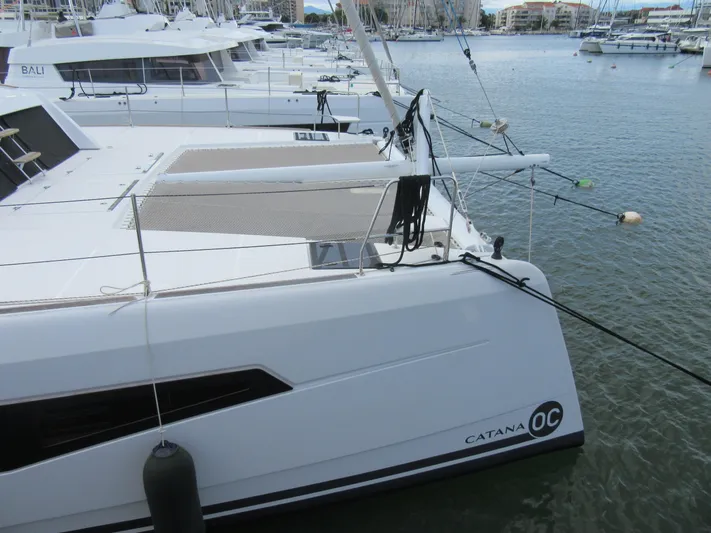 Heby Yacht Photos Pics 2023 Catana OC 50 catamaran docked in marina, side view.