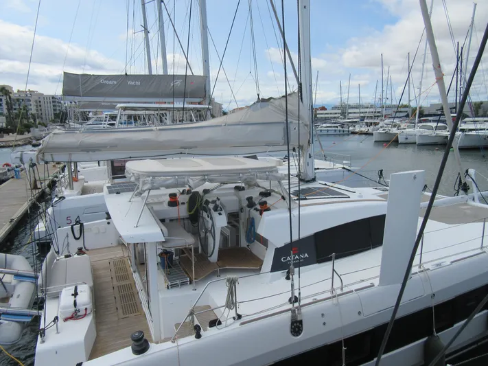 Heby Yacht Photos Pics 2023 Catana OC 50 catamaran docked at a marina, showcasing sleek design and spacious deck.