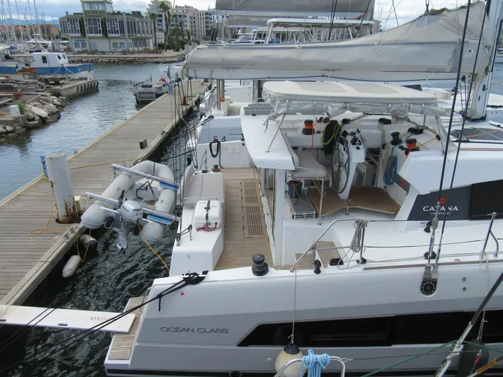Heby Yacht Photos Pics 2023 Catana OC 50 catamaran docked at marina, featuring spacious deck and modern design.