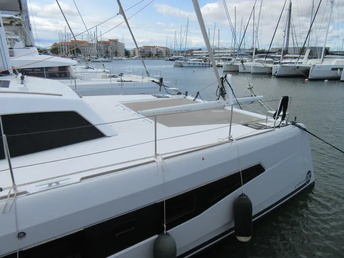 Heby Yacht Photos Pics 2023 Catana OC 50 catamaran docked in a marina, surrounded by other boats.