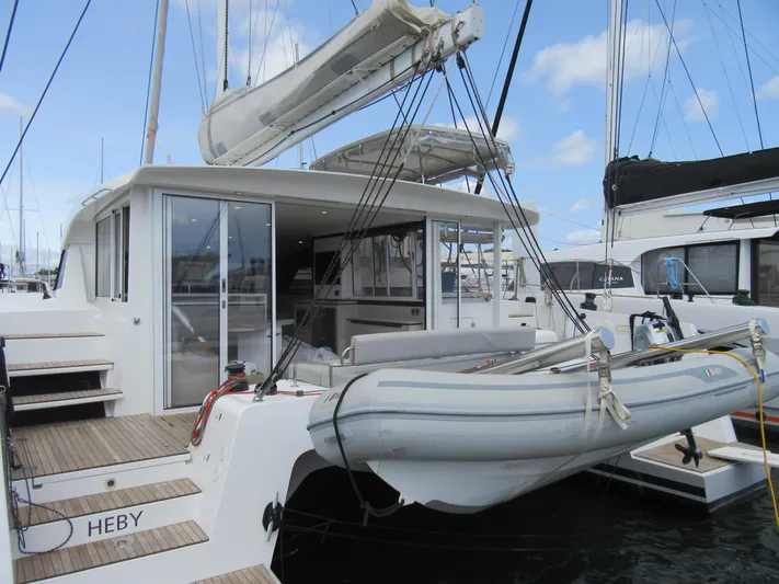 Heby Yacht Photos Pics 2023 Catana OC 50 yacht with dinghy, docked at marina.
