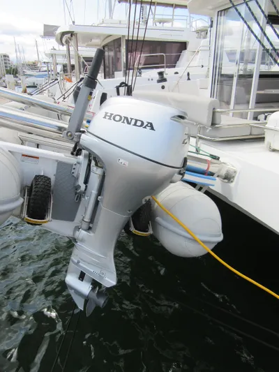 Heby Yacht Photos Pics Honda outboard motor on 2023 Catana OC 50 catamaran, docked in marina.