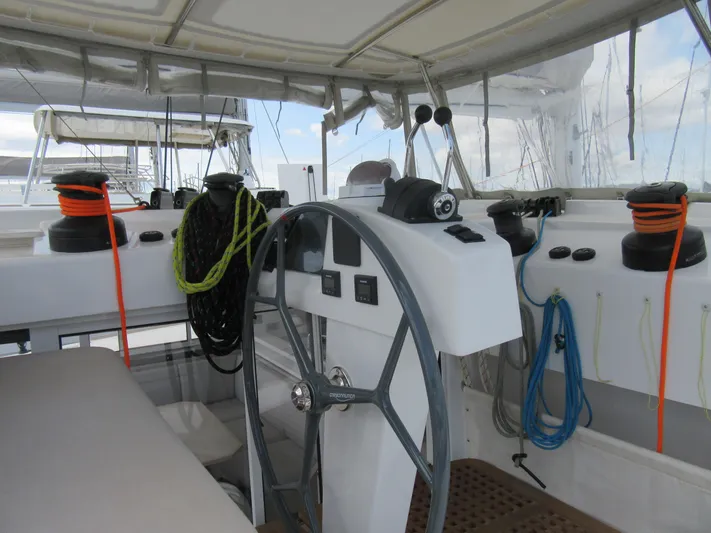 Heby Yacht Photos Pics Catana OC 50 yacht helm, 2023 model, featuring ropes and steering wheel.