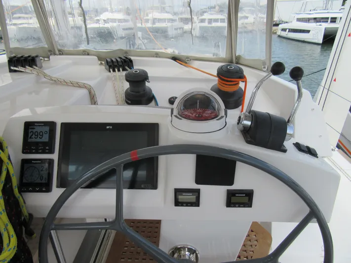 Heby Yacht Photos Pics Catana OC 50 yacht helm, 2023 model, featuring navigation instruments and steering wheel.