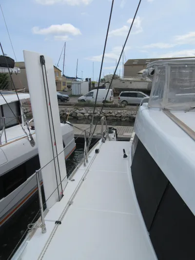 Heby Yacht Photos Pics 2023 Catana OC 50 catamaran docked at marina, side deck view.