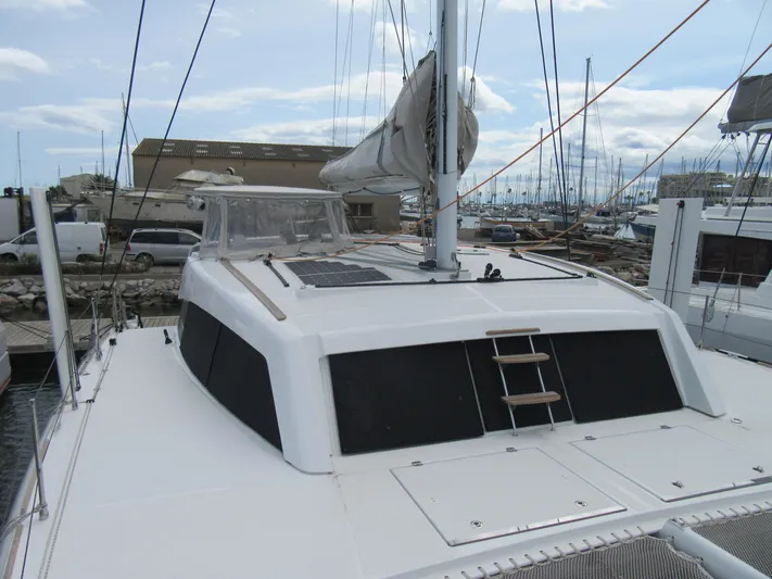 Heby Yacht Photos Pics 2023 Catana OC 50 catamaran docked at marina, showcasing sleek design and modern features.