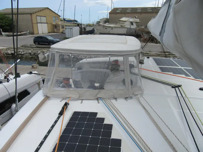 Heby Yacht Photos Pics 2023 Catana OC 50 yacht with solar panels and covered cockpit in a marina.