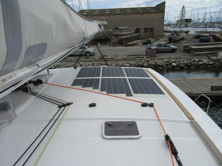 Heby Yacht Photos Pics 2023 Catana OC 50 yacht with solar panels on deck, docked at marina.