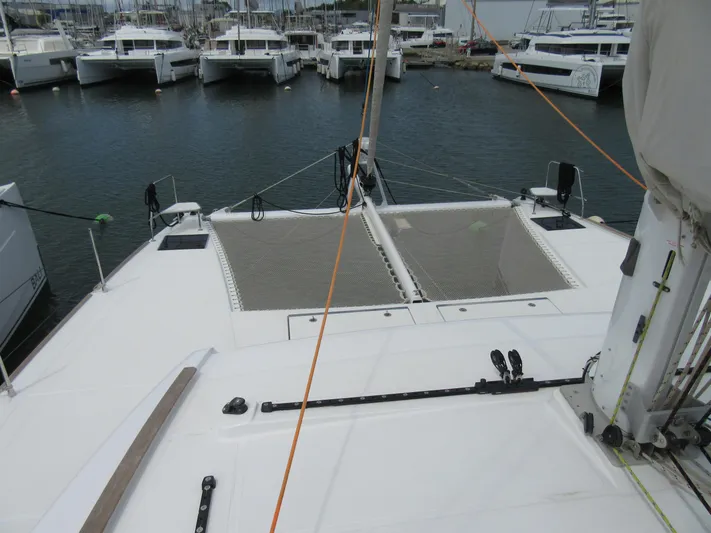 Heby Yacht Photos Pics 2023 Catana OC 50 catamaran docked in marina, showcasing deck and netting.