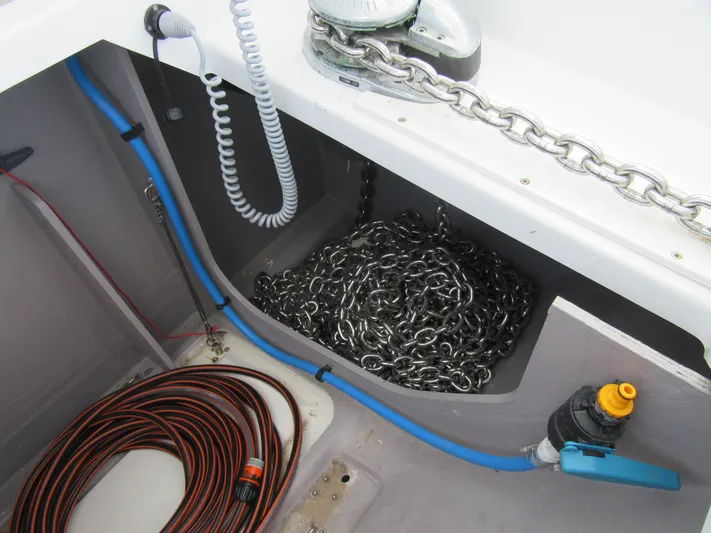 Heby Yacht Photos Pics Anchor chain storage on 2023 Catana OC 50 yacht, featuring coiled cables and marine equipment.