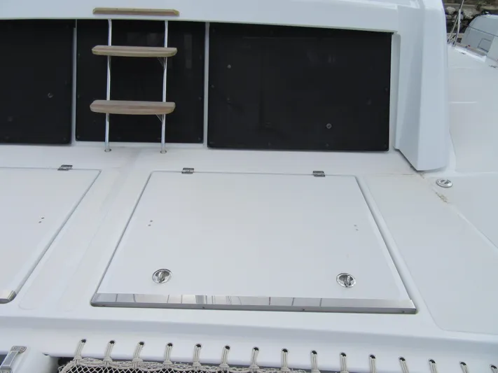 Heby Yacht Photos Pics 2023 Catana OC 50 yacht deck with storage hatches and ladder.