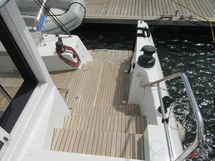 Heby Yacht Photos Pics Catana OC 50 yacht deck, 2023 model, with wooden flooring and docked at marina.
