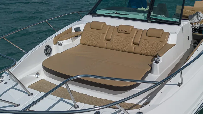 White Kraken Yacht Photos Pics 2023 Sea Ray Sundancer 320 boat with luxurious tan seating on deck.