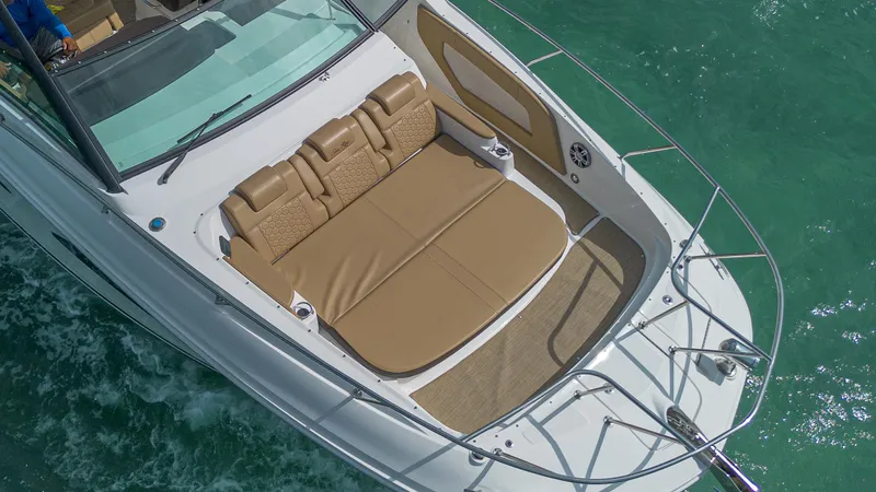 White Kraken Yacht Photos Pics 2023 Sea Ray Sundancer 320 boat with spacious sun deck on turquoise water.