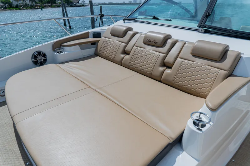 White Kraken Yacht Photos Pics Luxurious seating on 2023 Sea Ray Sundancer 320 yacht, featuring tan leather upholstery.