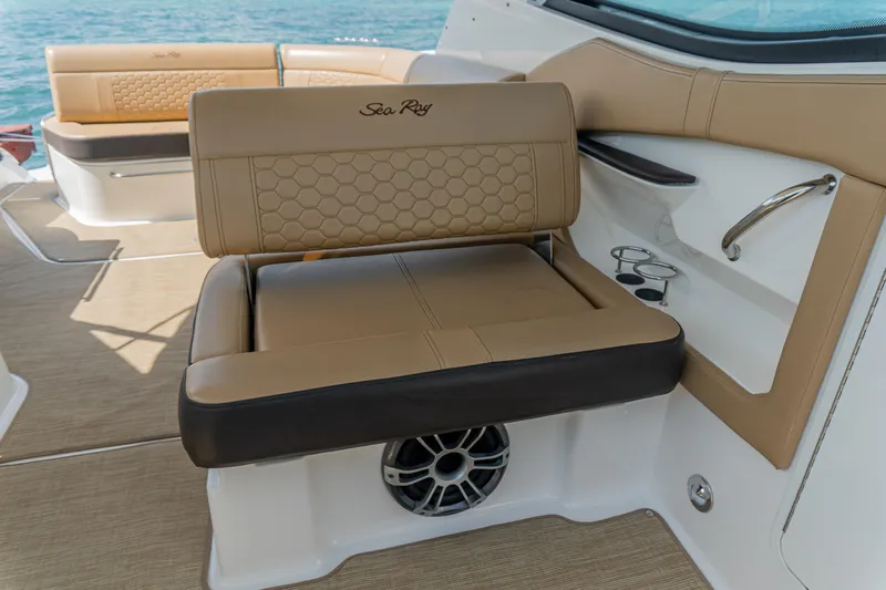 White Kraken Yacht Photos Pics 2023 Sea Ray Sundancer 320 interior with tan seating and cup holders.