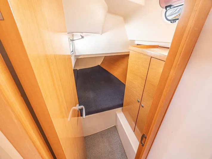  Yacht Photos Pics 2006 Hanse 370 yacht cabin interior with wooden finish and compact sleeping area.