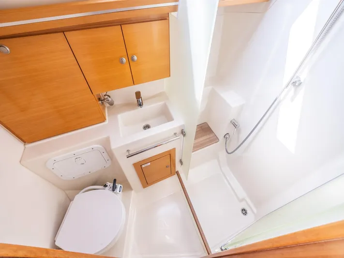  Yacht Photos Pics Compact bathroom in 2006 Hanse 370 yacht with shower, sink, and toilet.