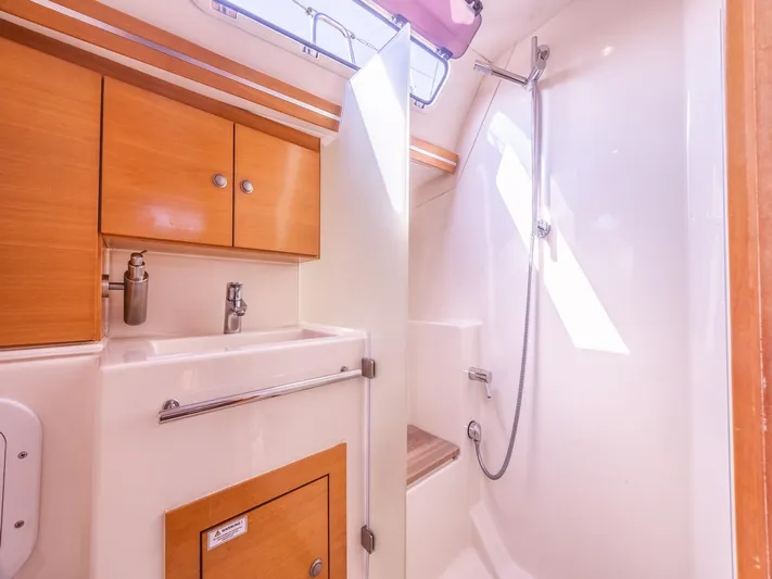  Yacht Photos Pics 2006 Hanse 370 yacht bathroom with wooden cabinets and modern shower.