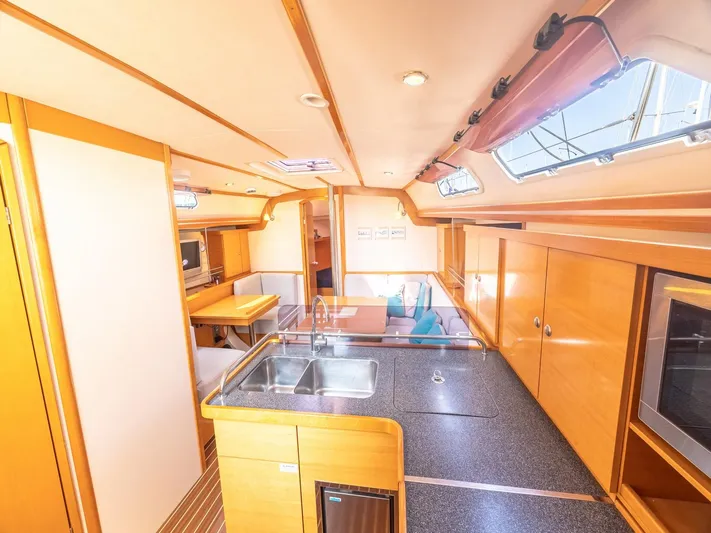  Yacht Photos Pics Interior of 2006 Hanse 370 yacht featuring modern kitchen and dining area.