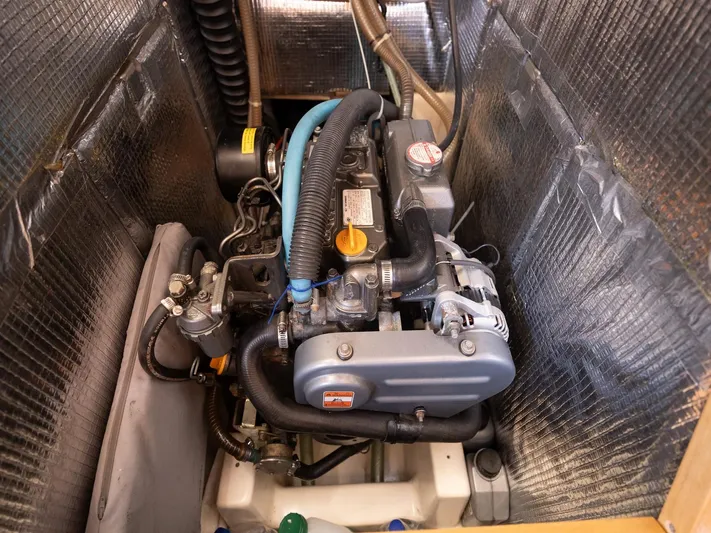  Yacht Photos Pics Engine compartment of a 2006 Hanse 370 sailboat, showcasing detailed mechanical components.