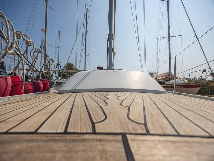  Yacht Photos Pics Deck view of 2006 Hanse 370 sailboat, showcasing sleek wooden design and rigging.
