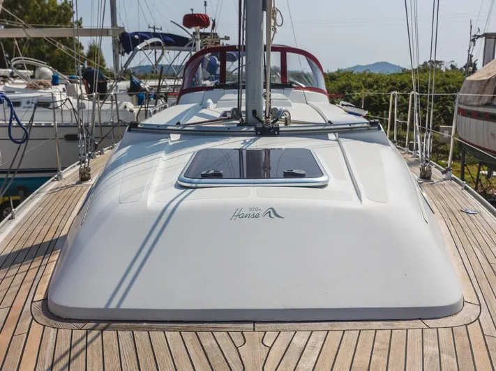  Yacht Photos Pics 2006 Hanse 370 sailboat deck with sleek design and wooden finish.