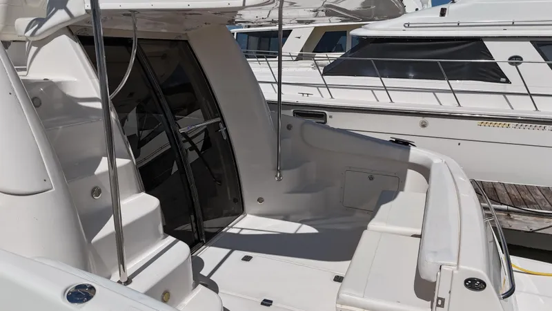 Barbie Hunter Yacht Photos Pics 2007 Regal 4080 Flybridge Sedan yacht with spacious deck and sleek design.