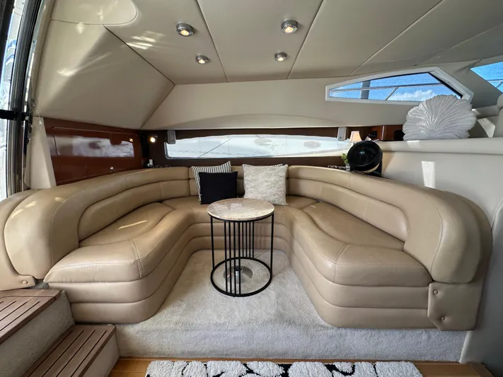 Barbie Hunter Yacht Photos Pics Luxurious interior of 2007 Regal 4080 Flybridge Sedan with beige leather seating.
