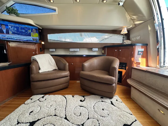 Barbie Hunter Yacht Photos Pics Luxurious 2007 Regal 4080 Flybridge Sedan interior with leather chairs and elegant decor.