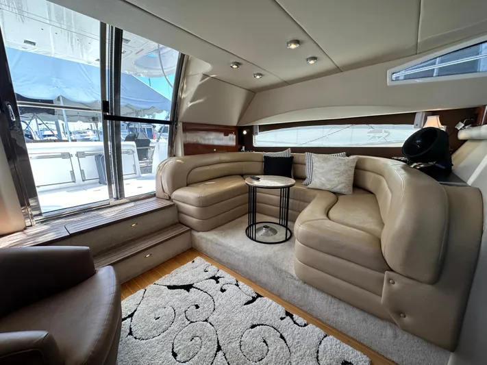 Barbie Hunter Yacht Photos Pics Luxurious interior of 2007 Regal 4080 Flybridge Sedan with plush seating and elegant decor.