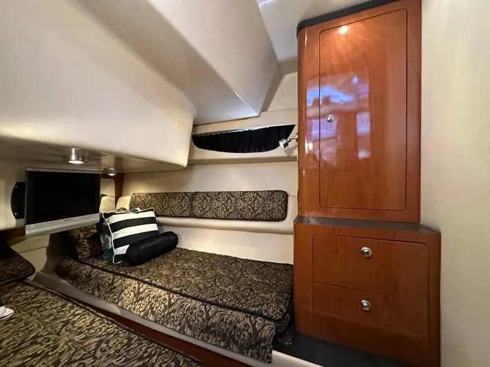 Barbie Hunter Yacht Photos Pics Luxurious cabin interior of 2007 Regal 4080 Flybridge Sedan with elegant wood cabinetry.