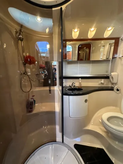 Barbie Hunter Yacht Photos Pics Luxurious bathroom in 2007 Regal 4080 Flybridge Sedan yacht with modern amenities.