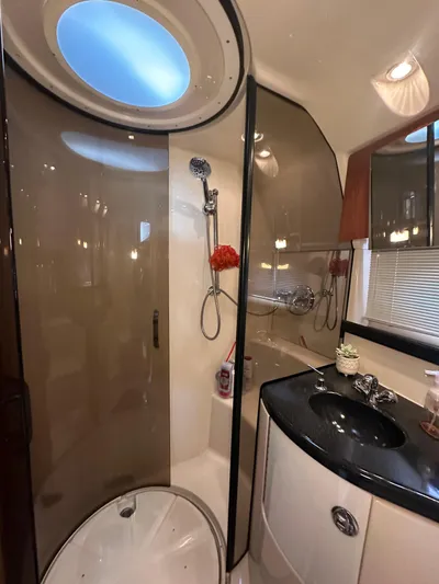 Barbie Hunter Yacht Photos Pics Luxurious bathroom in 2007 Regal 4080 Flybridge Sedan yacht with modern fixtures.