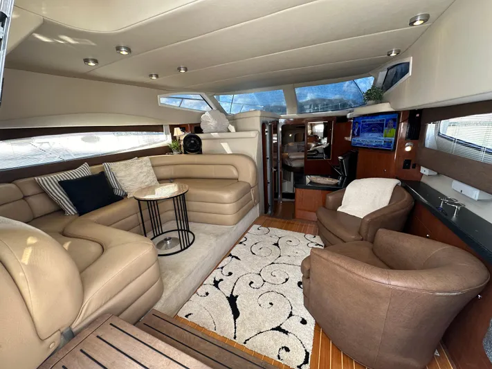 Barbie Hunter Yacht Photos Pics Luxurious interior of 2007 Regal 4080 Flybridge Sedan with plush seating and modern decor.