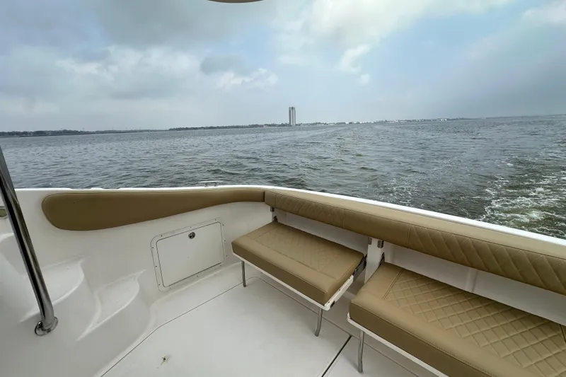 Barbie Hunter Yacht Photos Pics Regal 4080 Flybridge Sedan 2007 at sea with seating area.