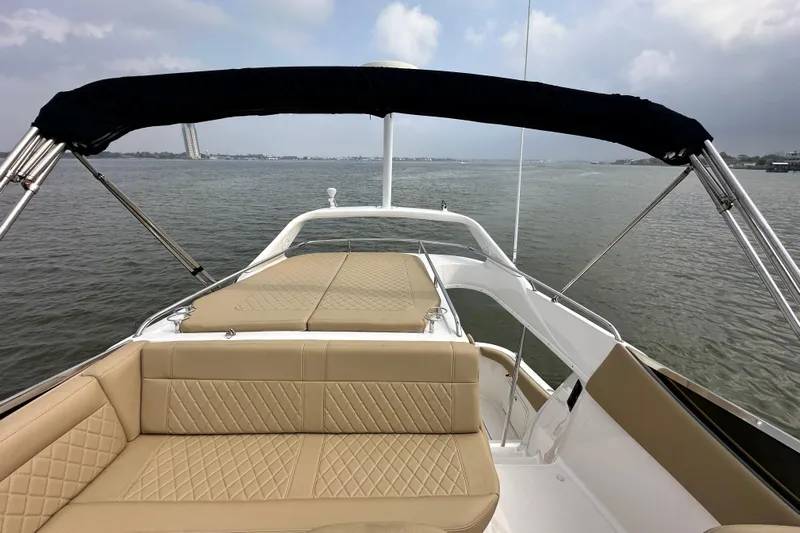 Barbie Hunter Yacht Photos Pics Regal 4080 Flybridge Sedan 2007 on calm waters.