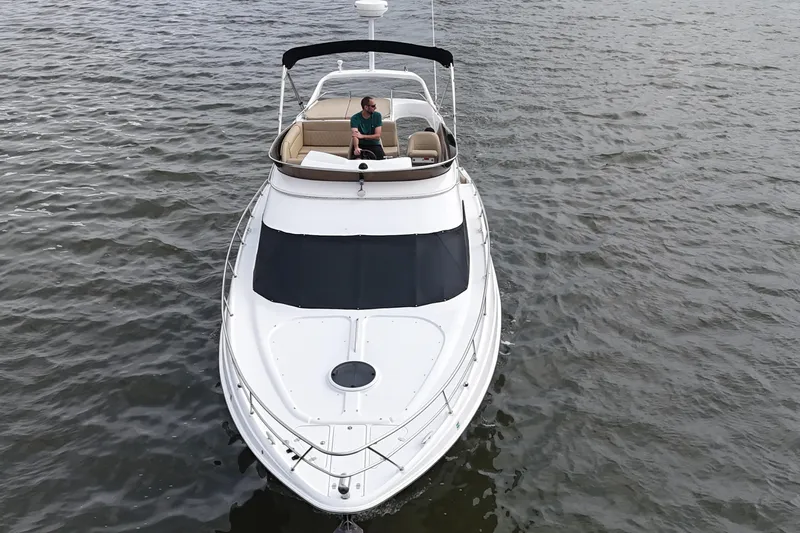 Barbie Hunter Yacht Photos Pics 2007 Regal 4080 Flybridge Sedan on water, aerial view.