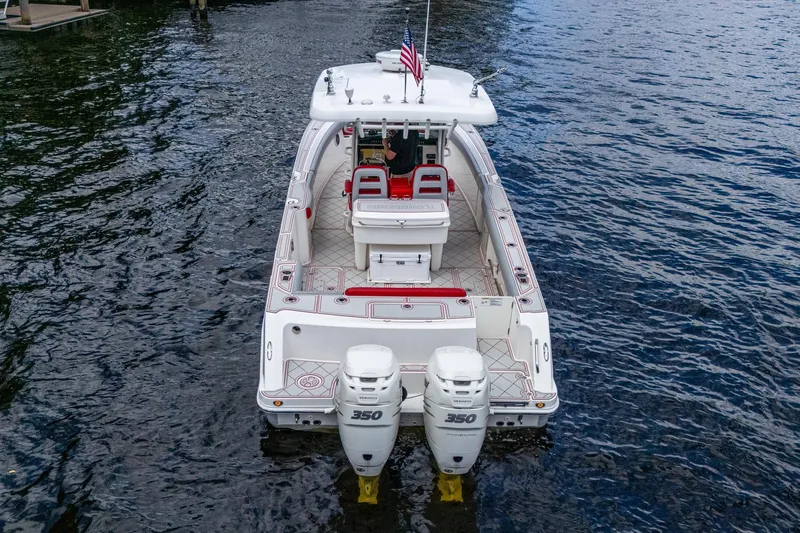 Dare To Dream's Sidechick Yacht Photos Pics 2018 Boston Whaler 330 boat with twin 350 engines on water.