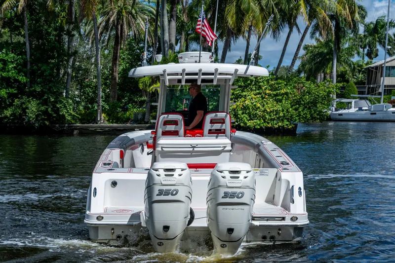Dare To Dream's Sidechick Yacht Photos Pics 2018 Boston Whaler 330 boat with dual 350 engines on a scenic waterway.