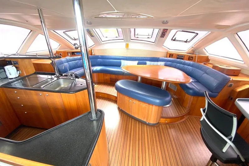  Yacht Photos Pics Luxurious interior of 2003 Catana 522 Ocean Class yacht with modern kitchen and seating area.