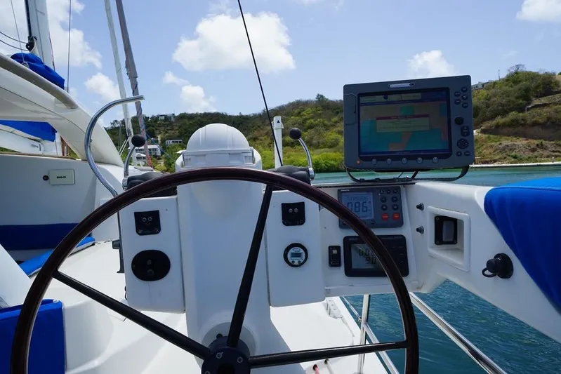  Yacht Photos Pics Steering wheel and navigation equipment on 2003 Catana 522 Ocean Class yacht.