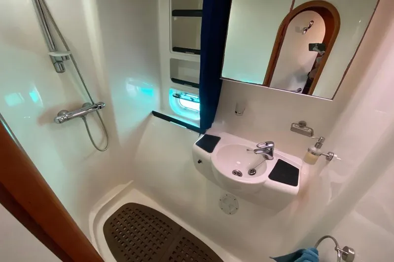  Yacht Photos Pics Bathroom interior of 2003 Catana 522 Ocean Class yacht, featuring shower and sink.