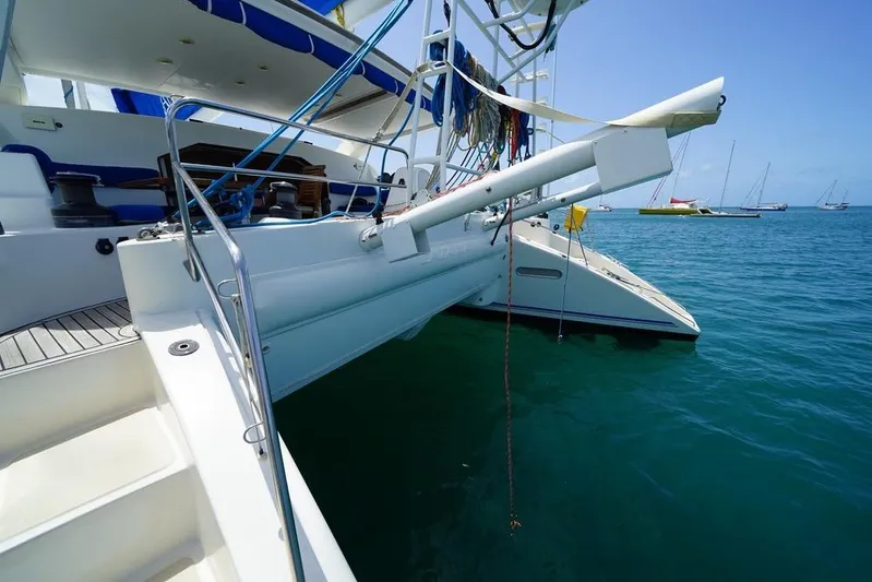  Yacht Photos Pics Catana 522 Ocean Class 2003 catamaran docked in clear blue water.