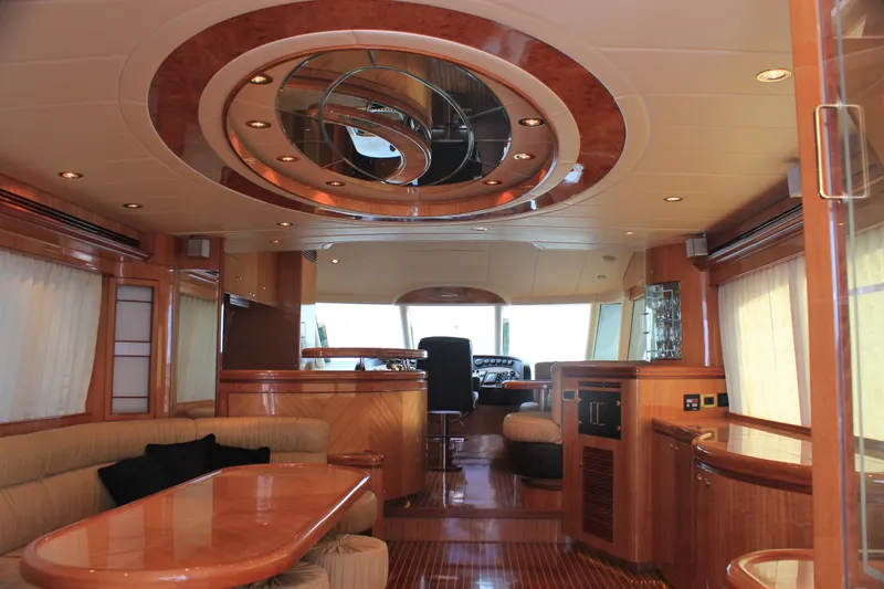 Osprey Yacht Photos Pics Luxurious interior of 2004 Horizon P70 yacht with elegant wood finishes and modern design.