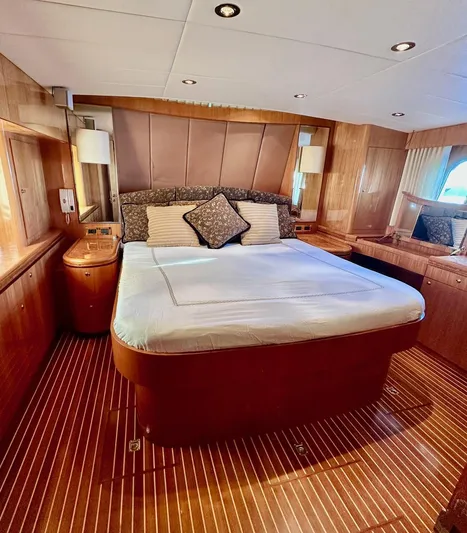 Osprey Yacht Photos Pics Luxurious cabin interior of 2004 Horizon P70 yacht with elegant wood finish.