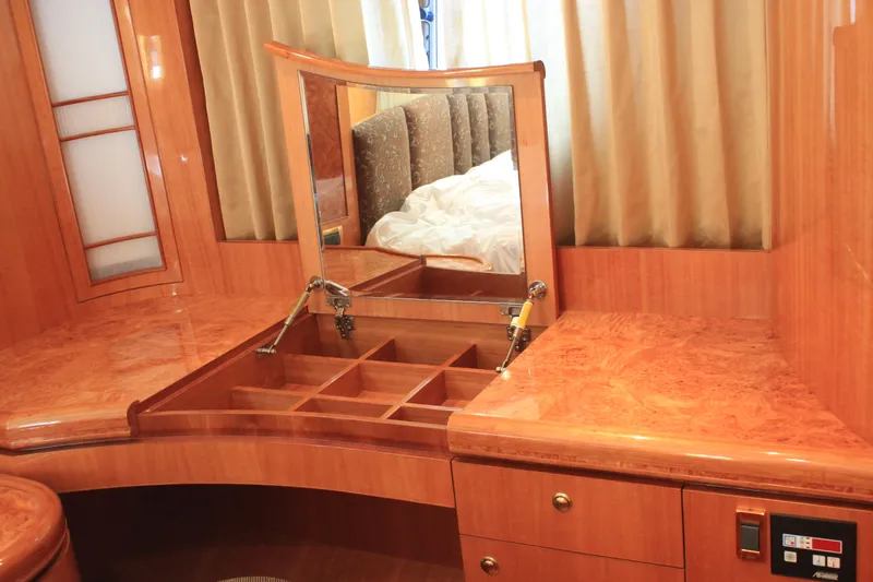 Osprey Yacht Photos Pics Luxurious wooden vanity with mirror and storage compartments on Horizon P70 yacht, 2004 model.
