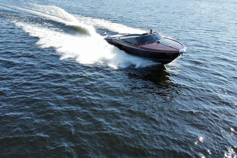  Yacht Photos Pics 2025 Riva Aquariva Special speedboat cruising on open water.