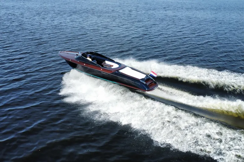  Yacht Photos Pics 2025 Riva Aquariva Special luxury yacht cruising on open water.